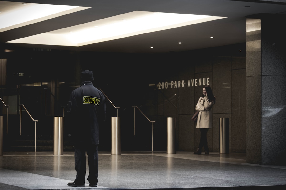 Security guard positioned at a property entrance